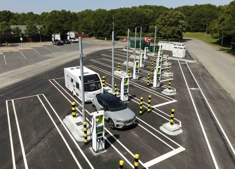 A car towing a caravan charging at GRIDSERVE Tamworth